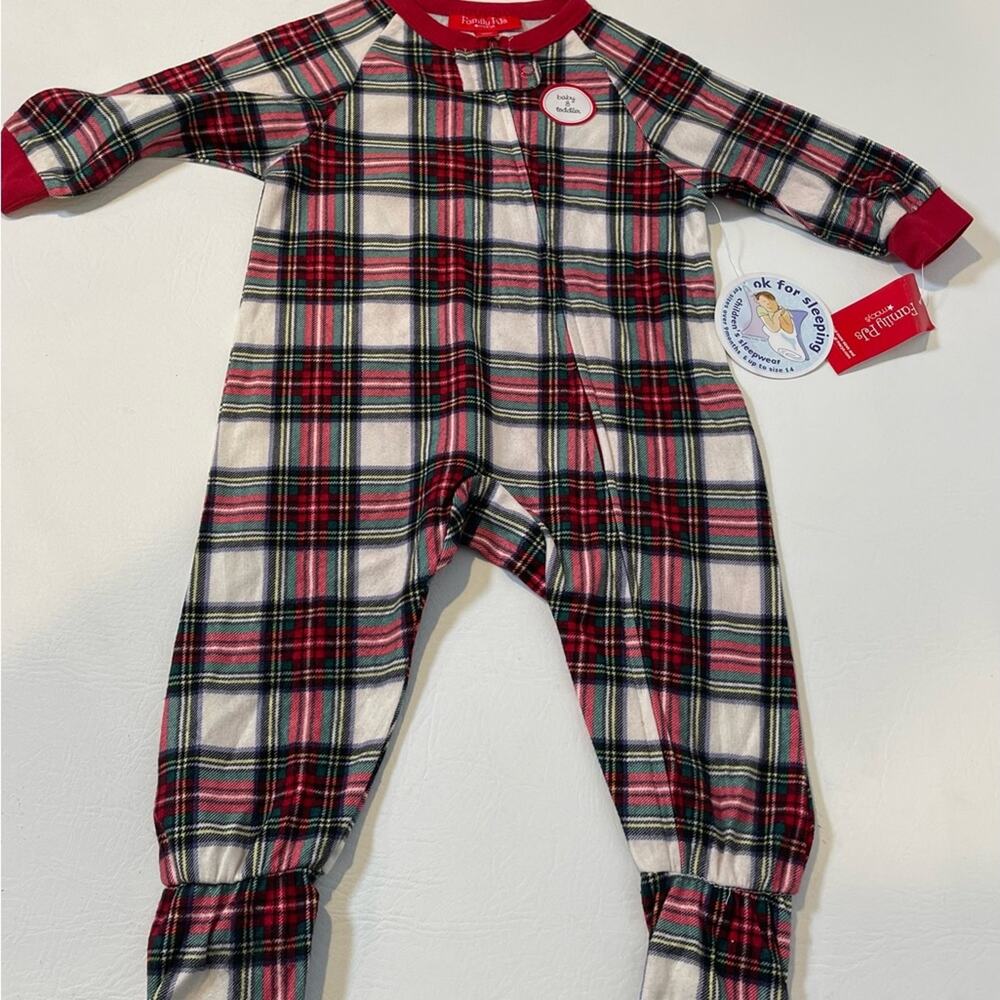 Family PJ’s by Macy’s. 12 month. One piece with zipper front and footies. NWT.